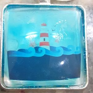 Great Lighthouse on the sea with starfish, 1"&1/4" square glass 16" necklace.